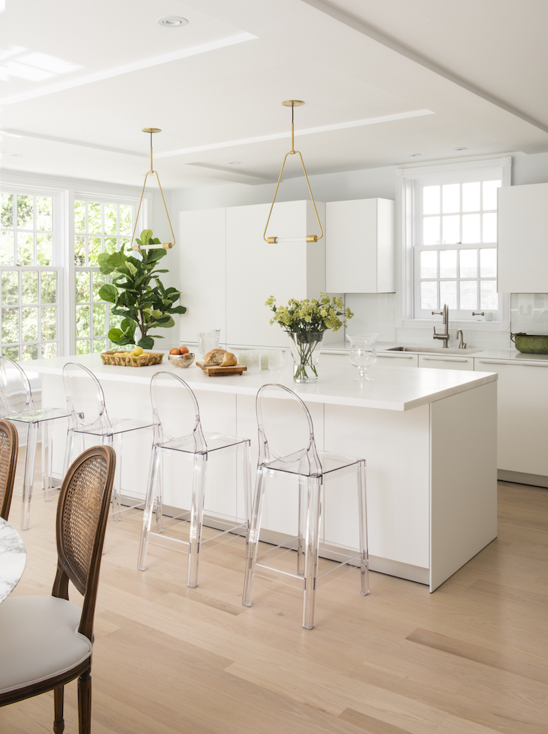 Lucite dining stools in white kitchen via MHOUSE