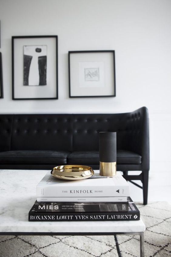 Marble coffee table with black couch