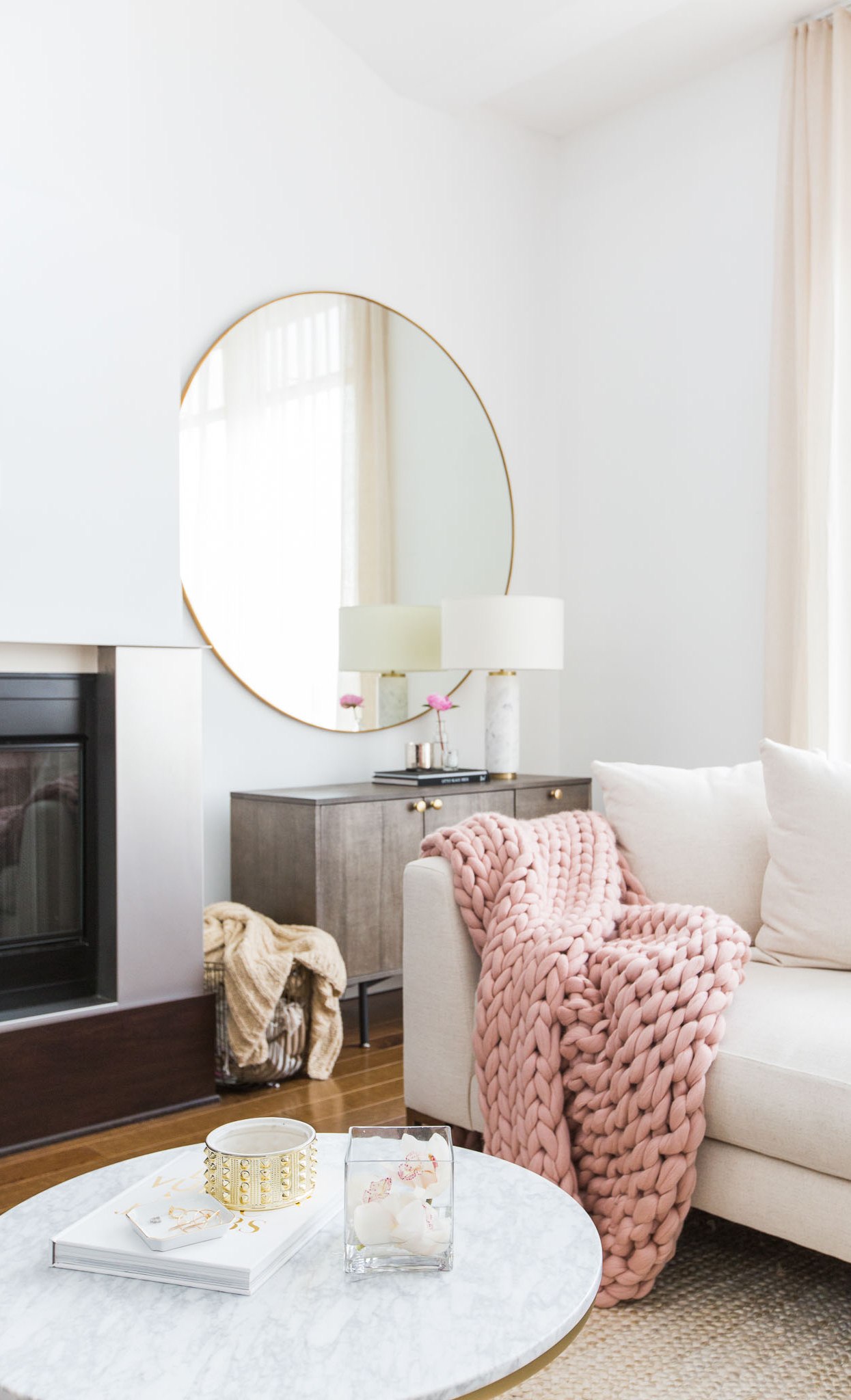 Marble coffee table with neutral couch in Marianna Hewitt's home