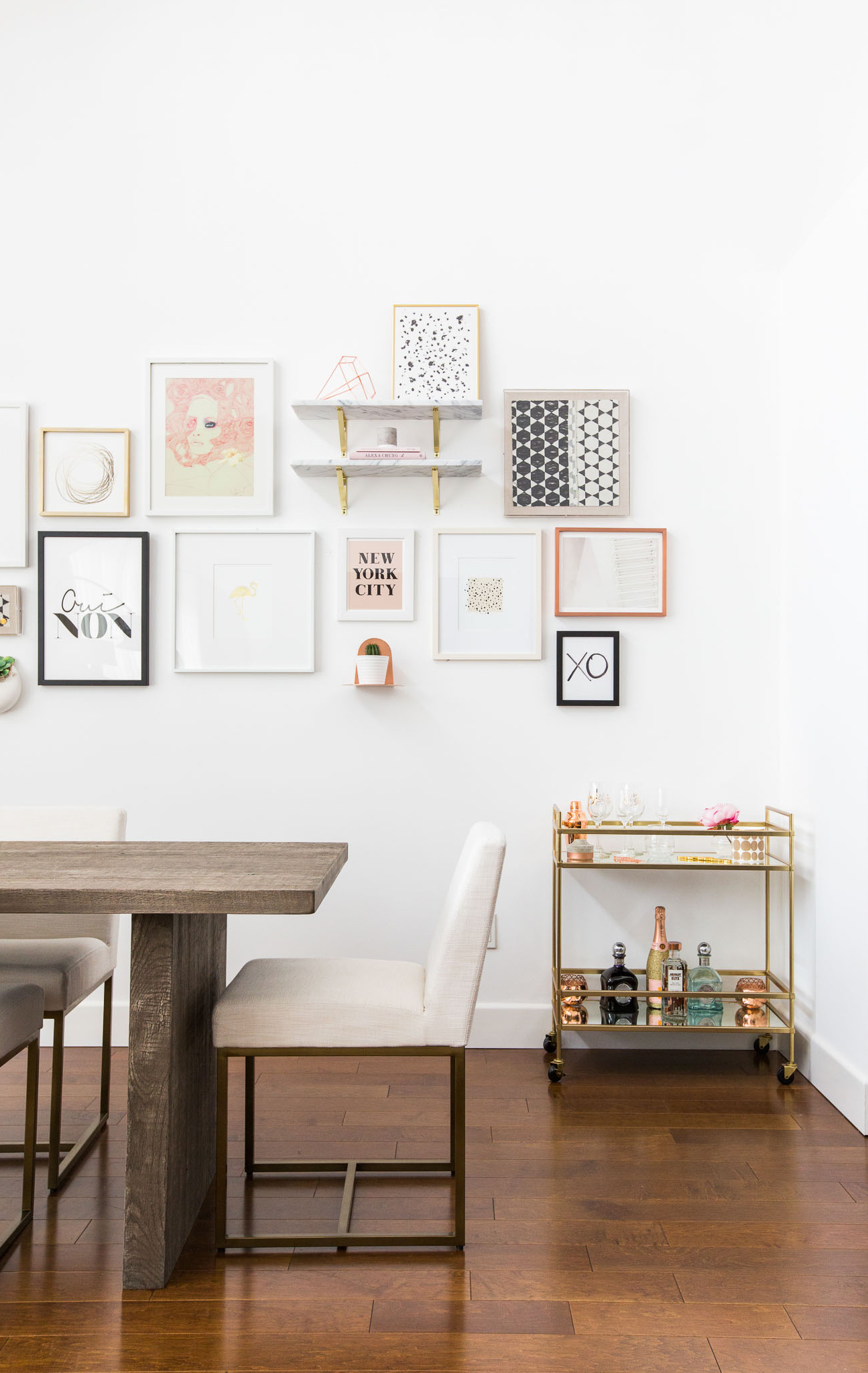 Marianna Hewitt's dining room with barcart and gallery wall