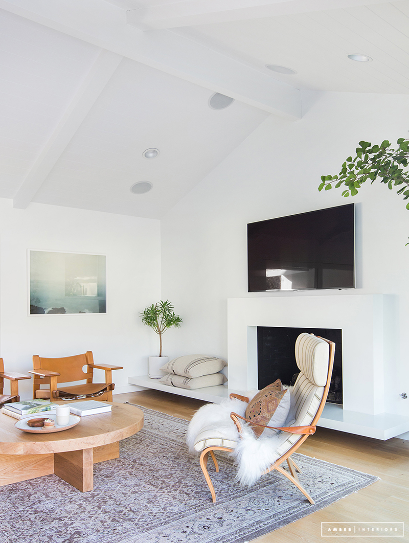 Minimalist Mid-Century living space with grey rug