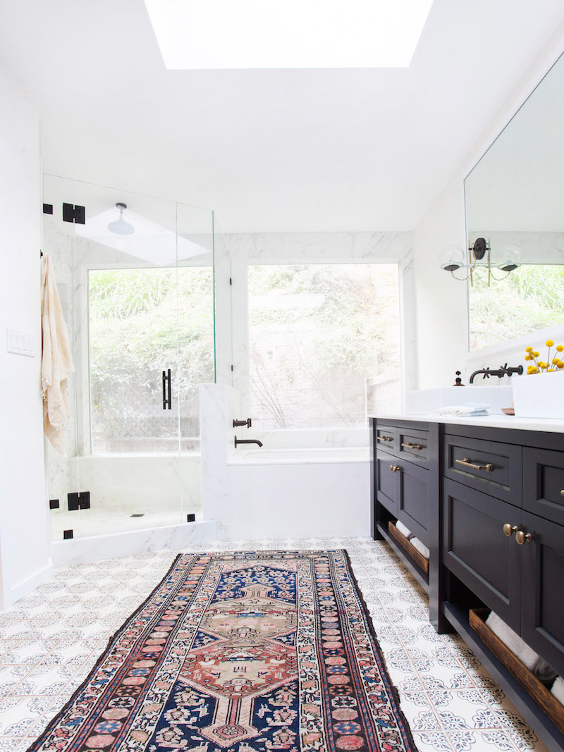 Oriental rug bathroom via Amber Interiors