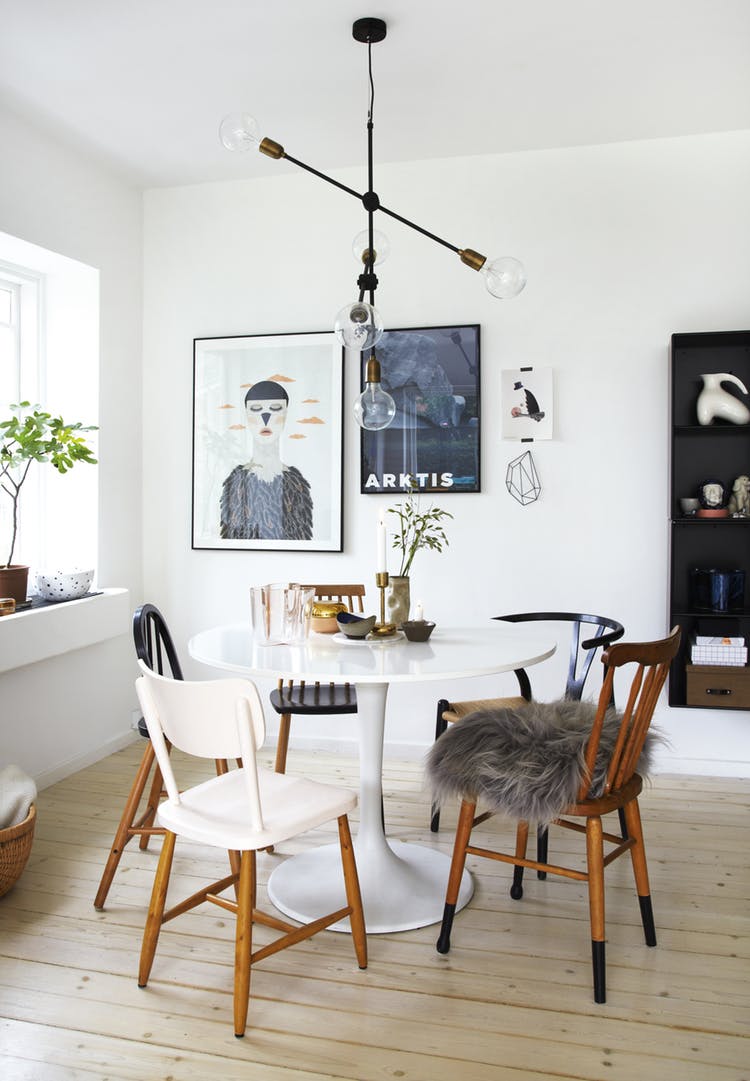 Scandinavian dining room with mismatched chairs