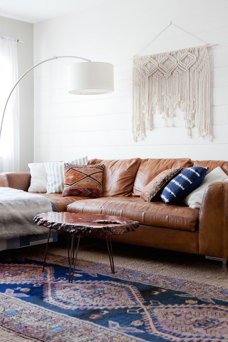 Tan leather sofa living room by Veneer Designs