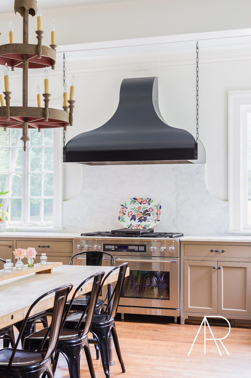 Black tolix chairs in modern dining room via Alyssa Rosenheck