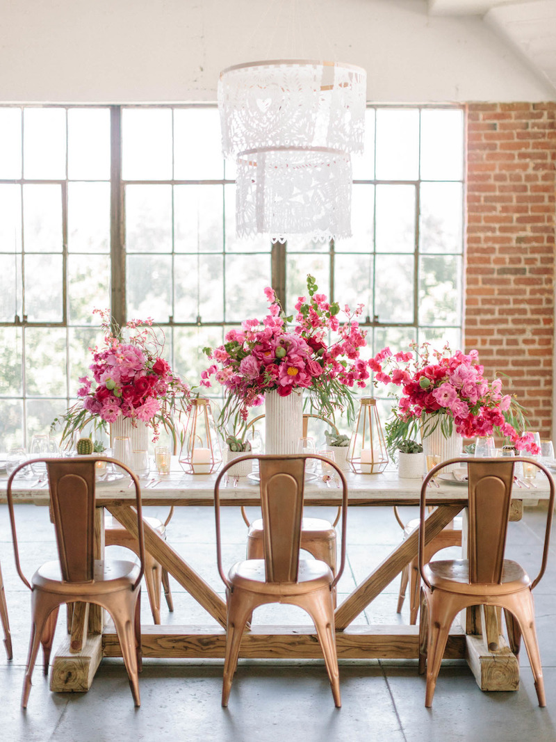 Copper tolix chairs with pink flower table setting