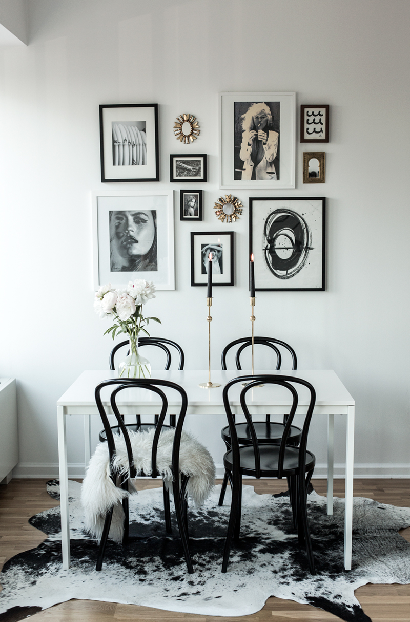 Gallery wall with black bentwood chairs in dining room