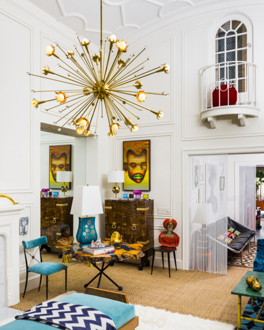 Jonathan Adler living room with gold starburst chandelier