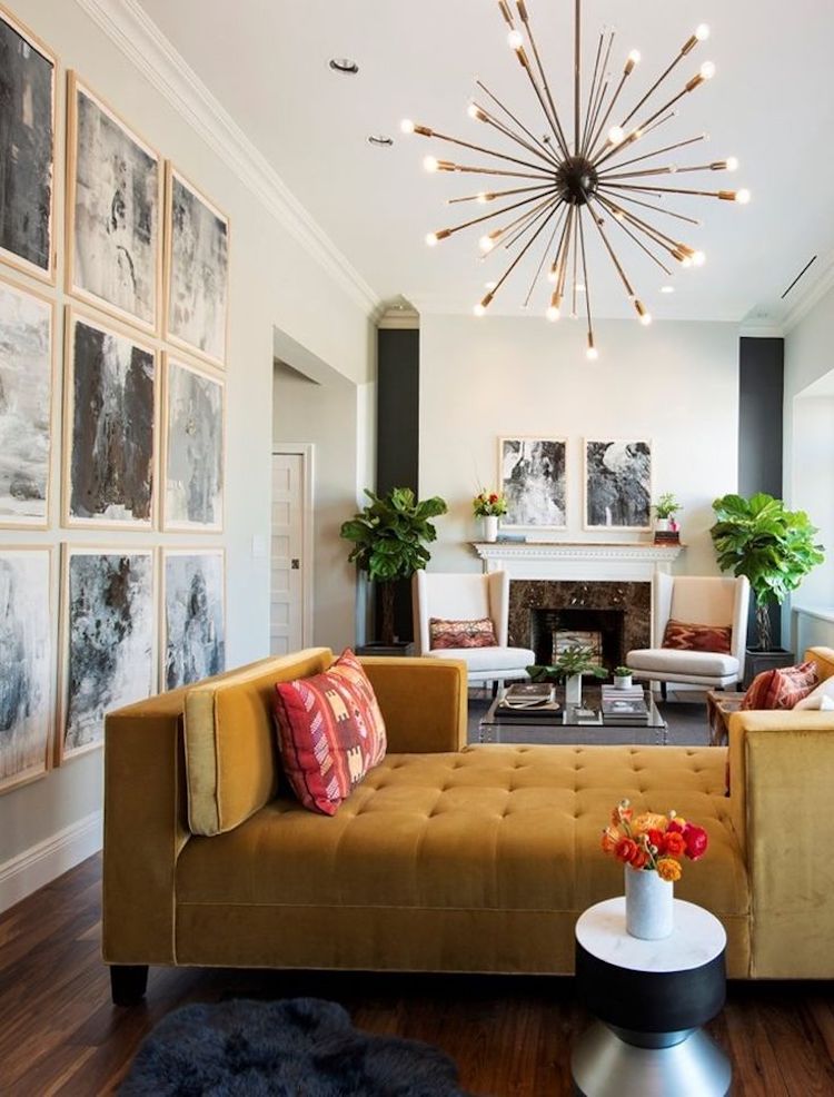 Mustard couch with starburst chandelier via Richard Caplan