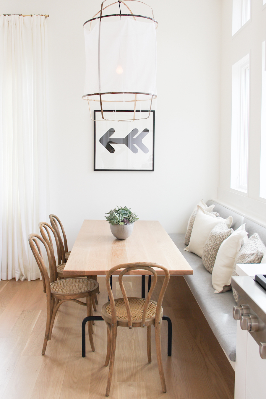 Natural wood bentwood chairs with banquette via 30collins