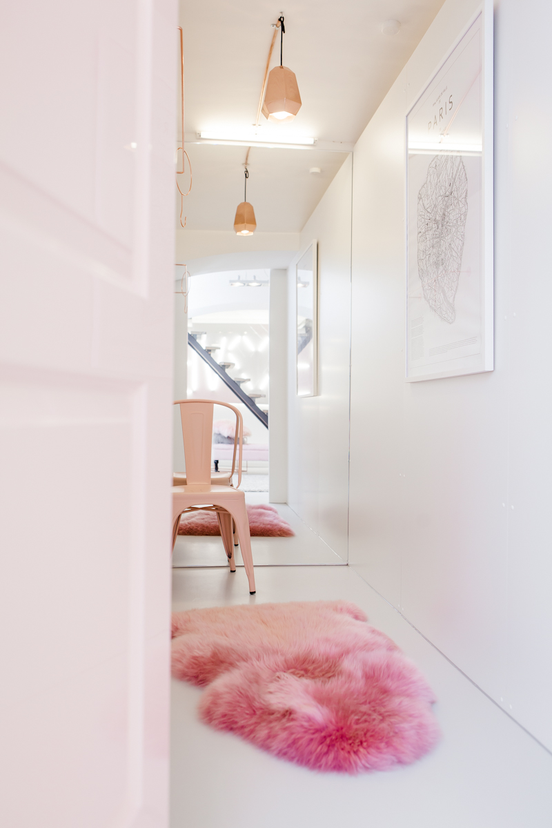 Pink Tolix chair with pink sheepskin rug