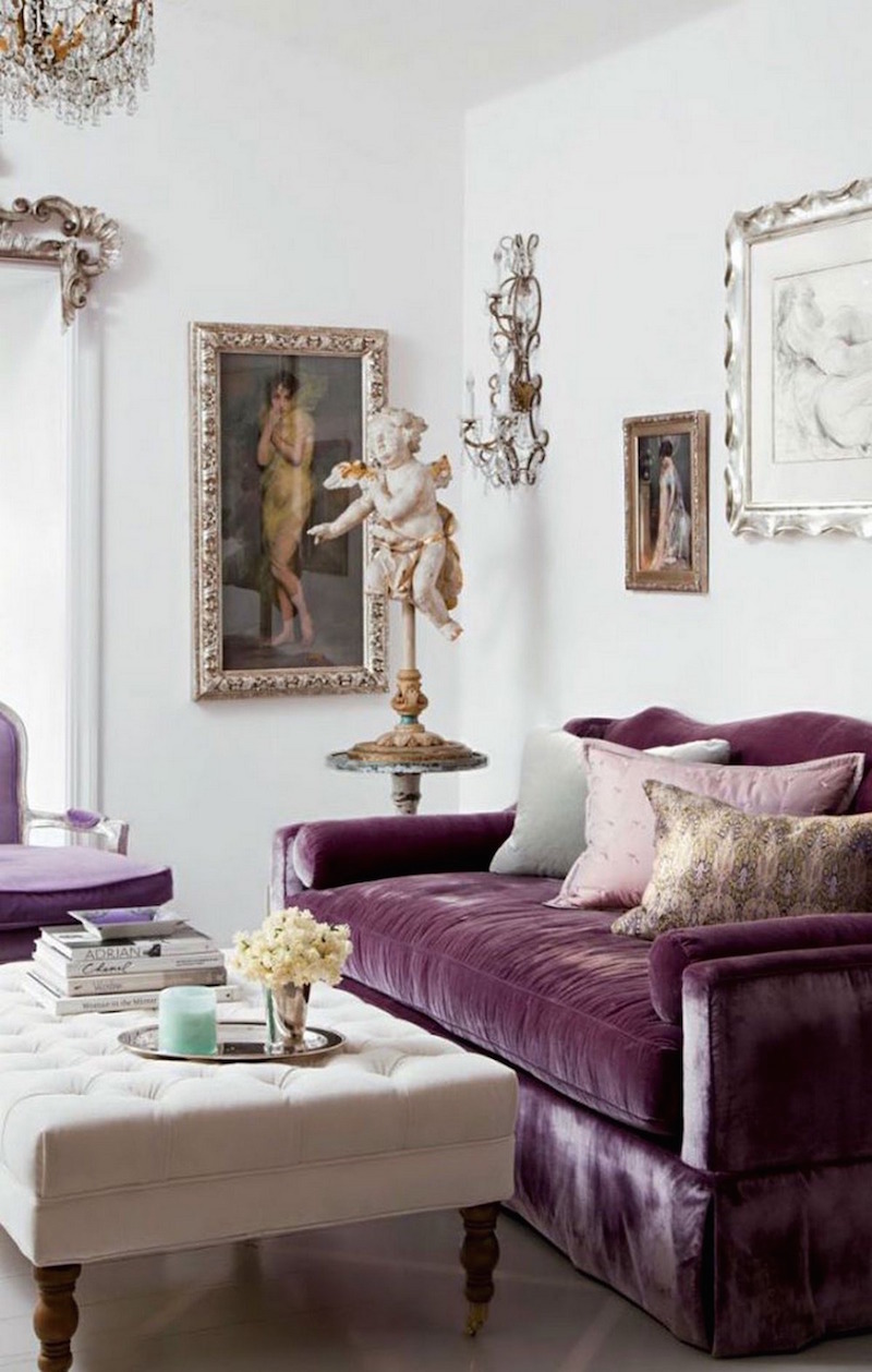 Purple velvet couch with angel sculpture via AD