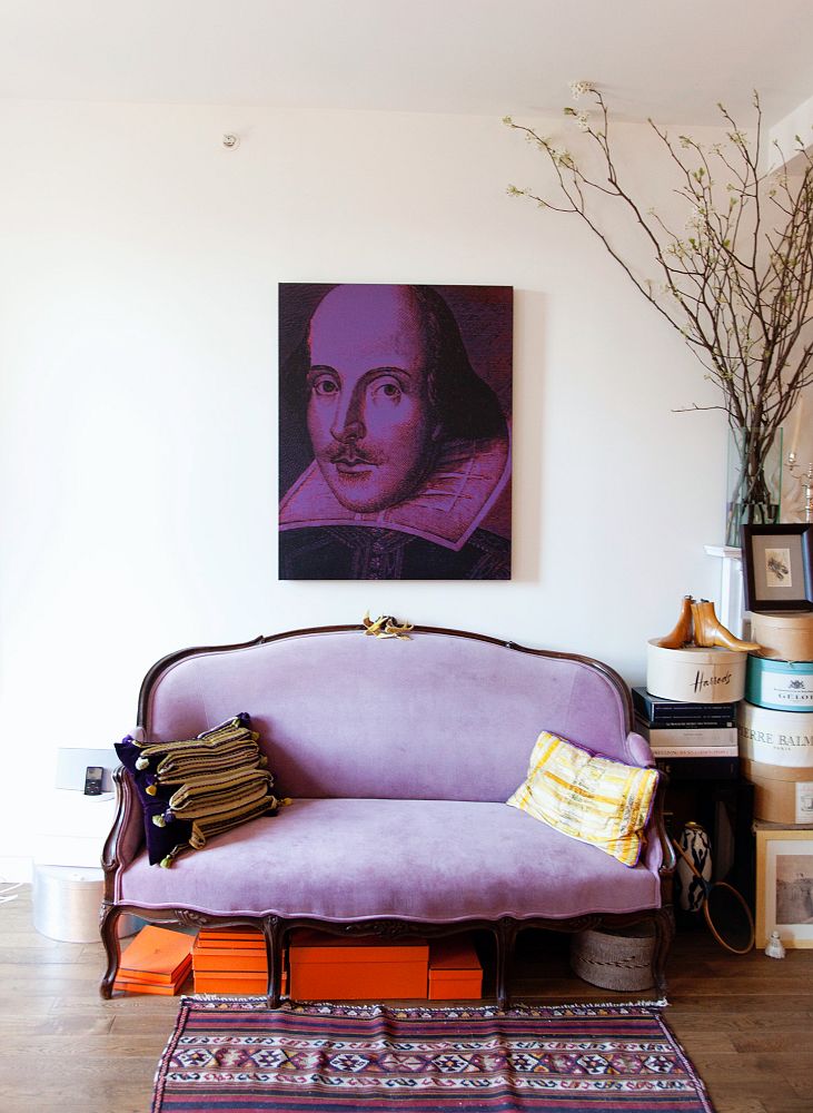 Purple velvet french sofa with Shakespeare art via The Selby