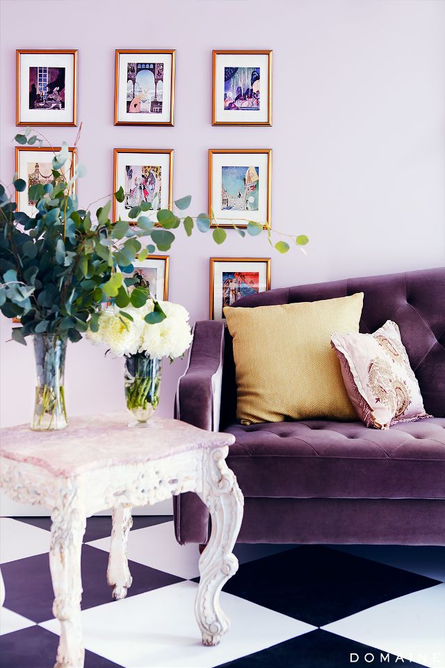 Purple velvet sofa with vintage white table