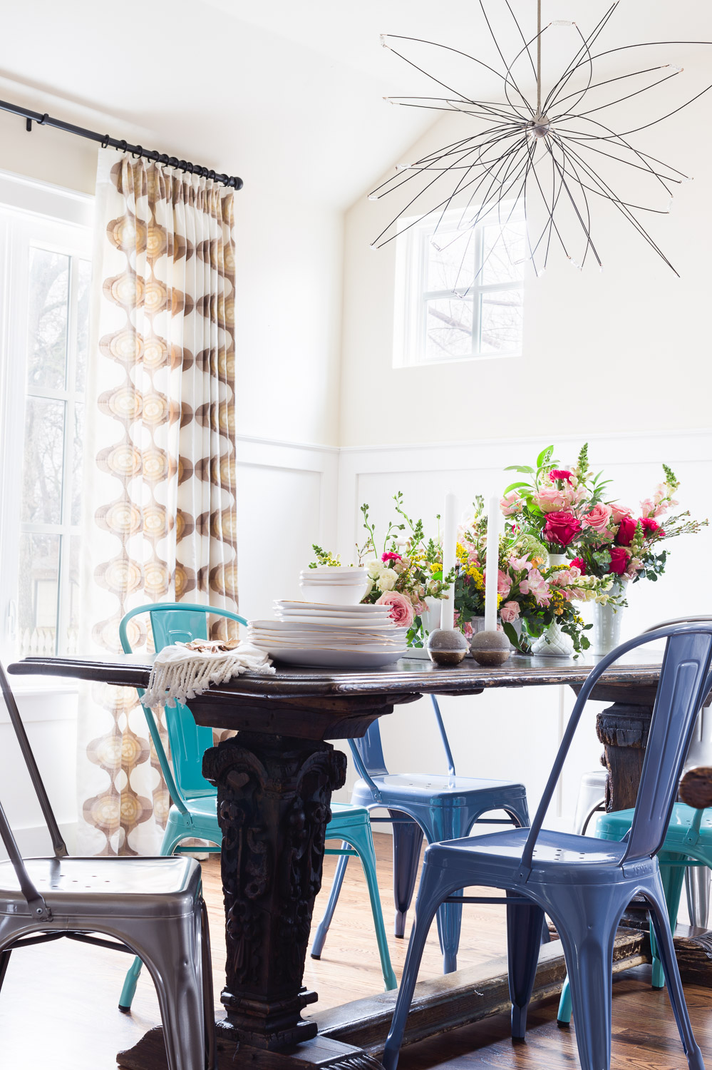 Shades of blue tolix chairs in dining room via Rue Mag