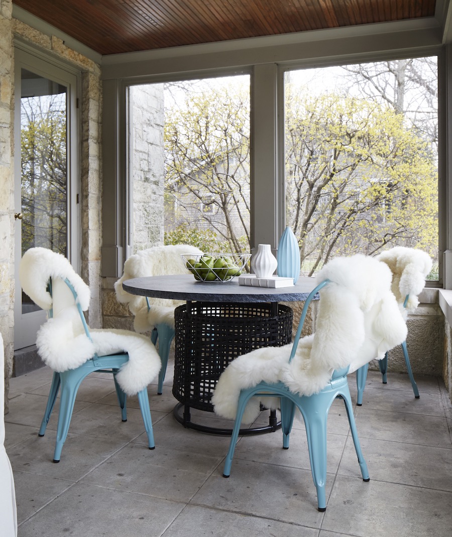 Soft blue tolix chairs with white sheepskin throws via Amy Kartheiser Design