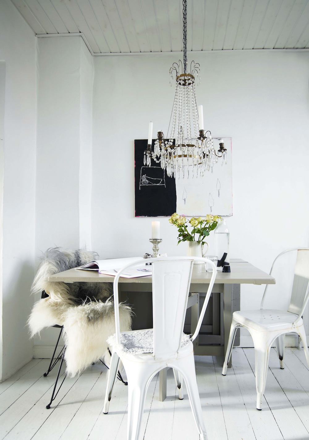 White tolix chairs with crystal chandelier