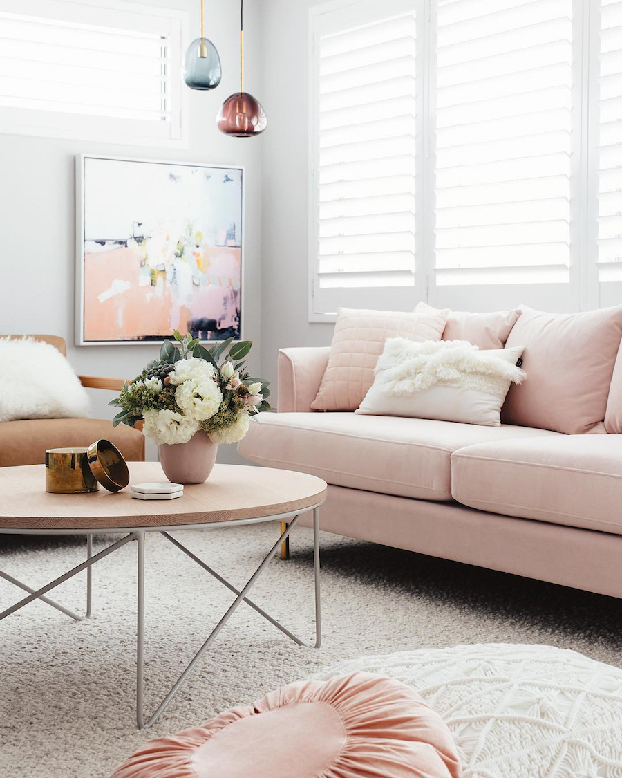 Blush pink sofa with abstract art via Jenni Farr