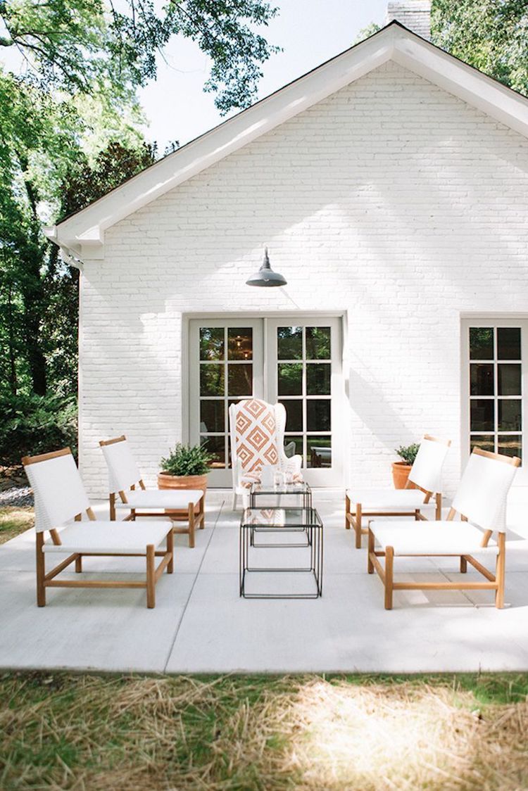 White chairs on a grey stone patio