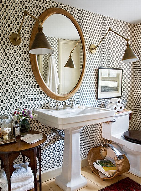 Bathroom with tiling on wall and large brass swing arm sconces