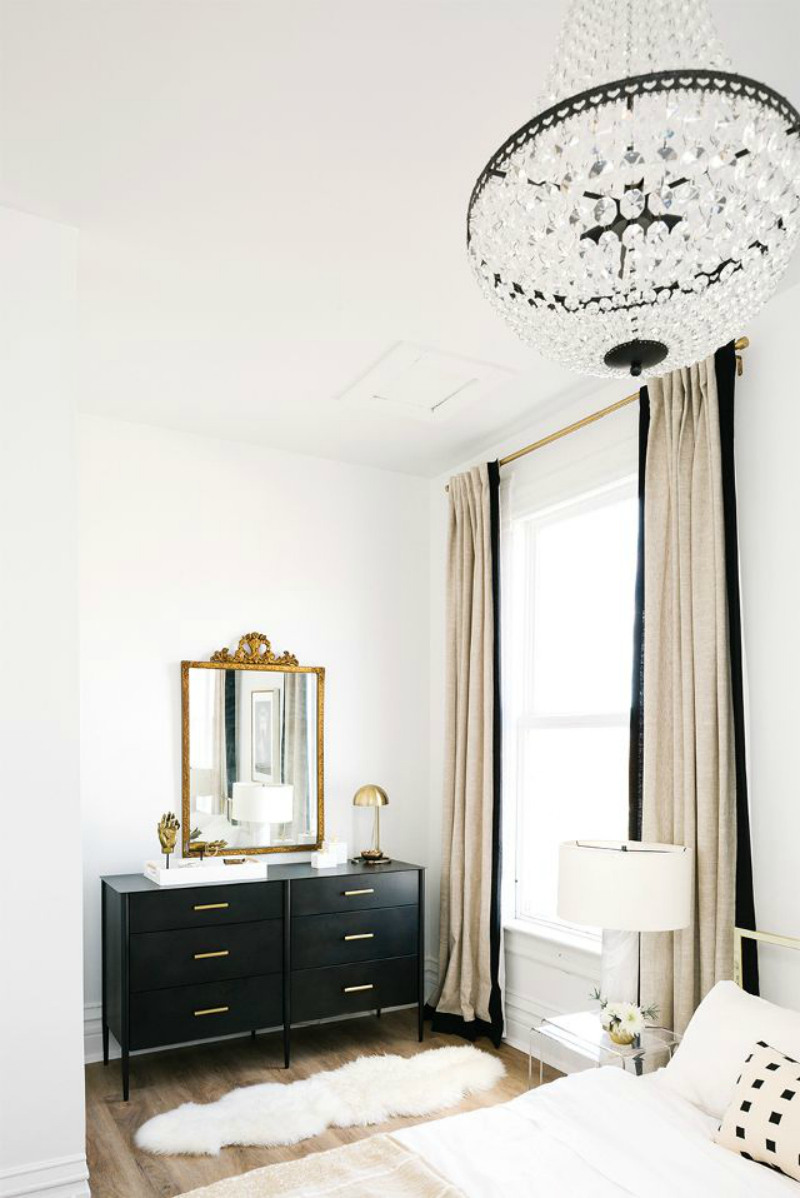 Black wide dresser with gold handles in Bedroom