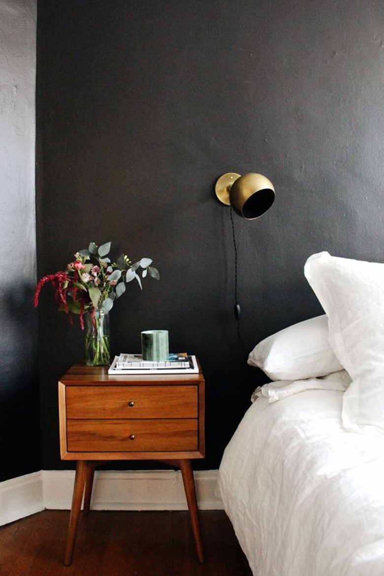 Brass Sconce against Black bedroom wall via Elise Joseph