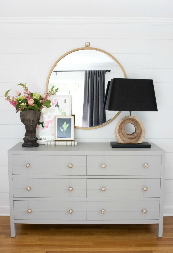 Gray wide dresser with metallic knobs