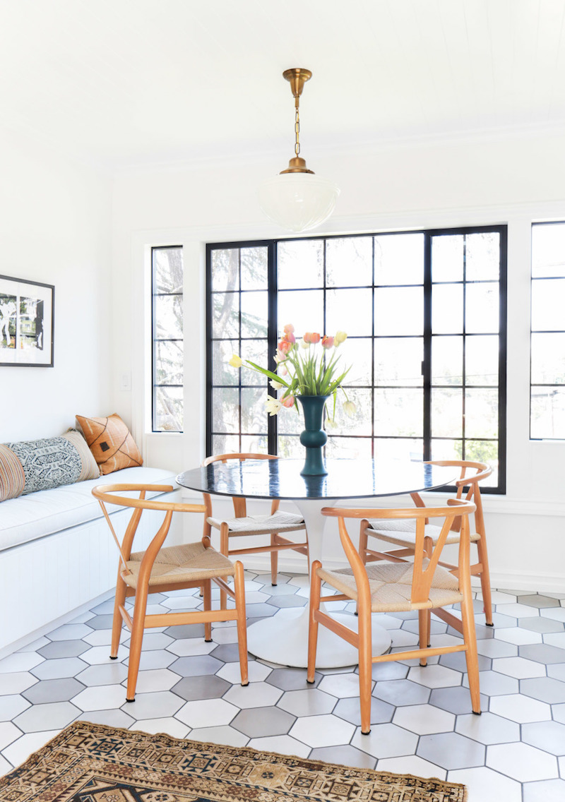 Natural wishbone chairs in breakfast nook via Homepolish