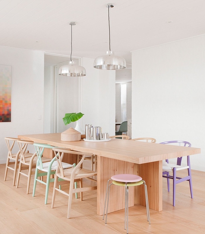 Pastel wishbone chairs in neutral dining room via Hecker Guthrie