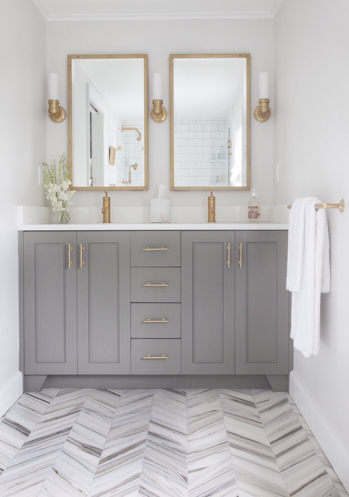 White And Gray Bathroom with Brass Scones and Double Vanity via Postbox Designs