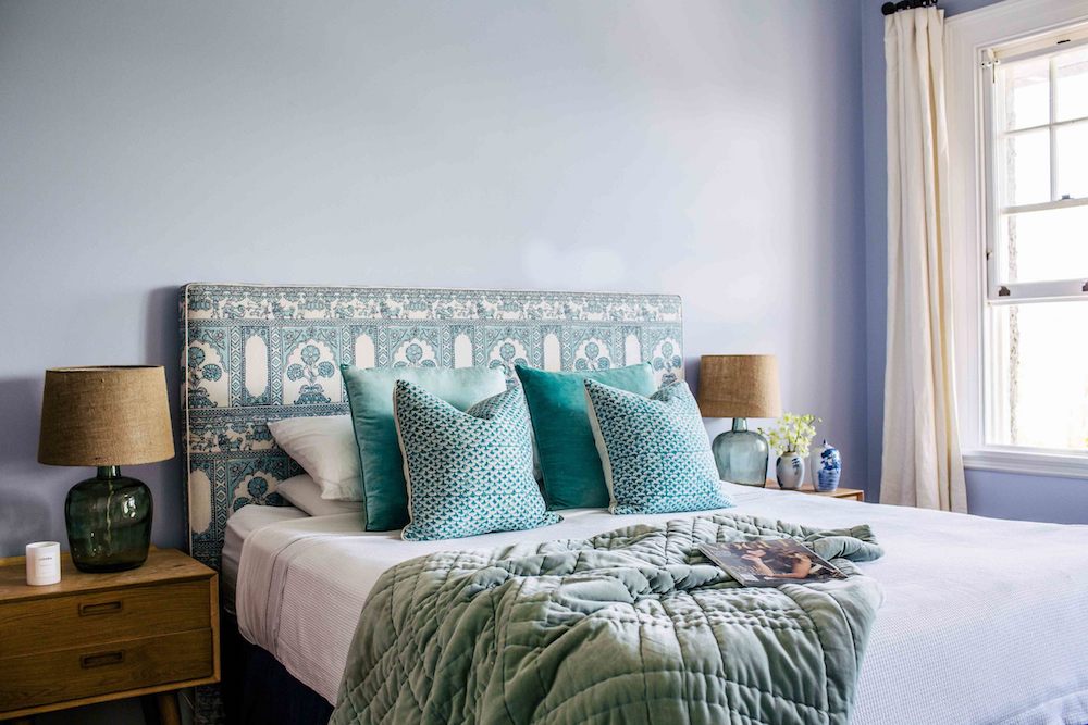 Bedroom with blue fabric headboard