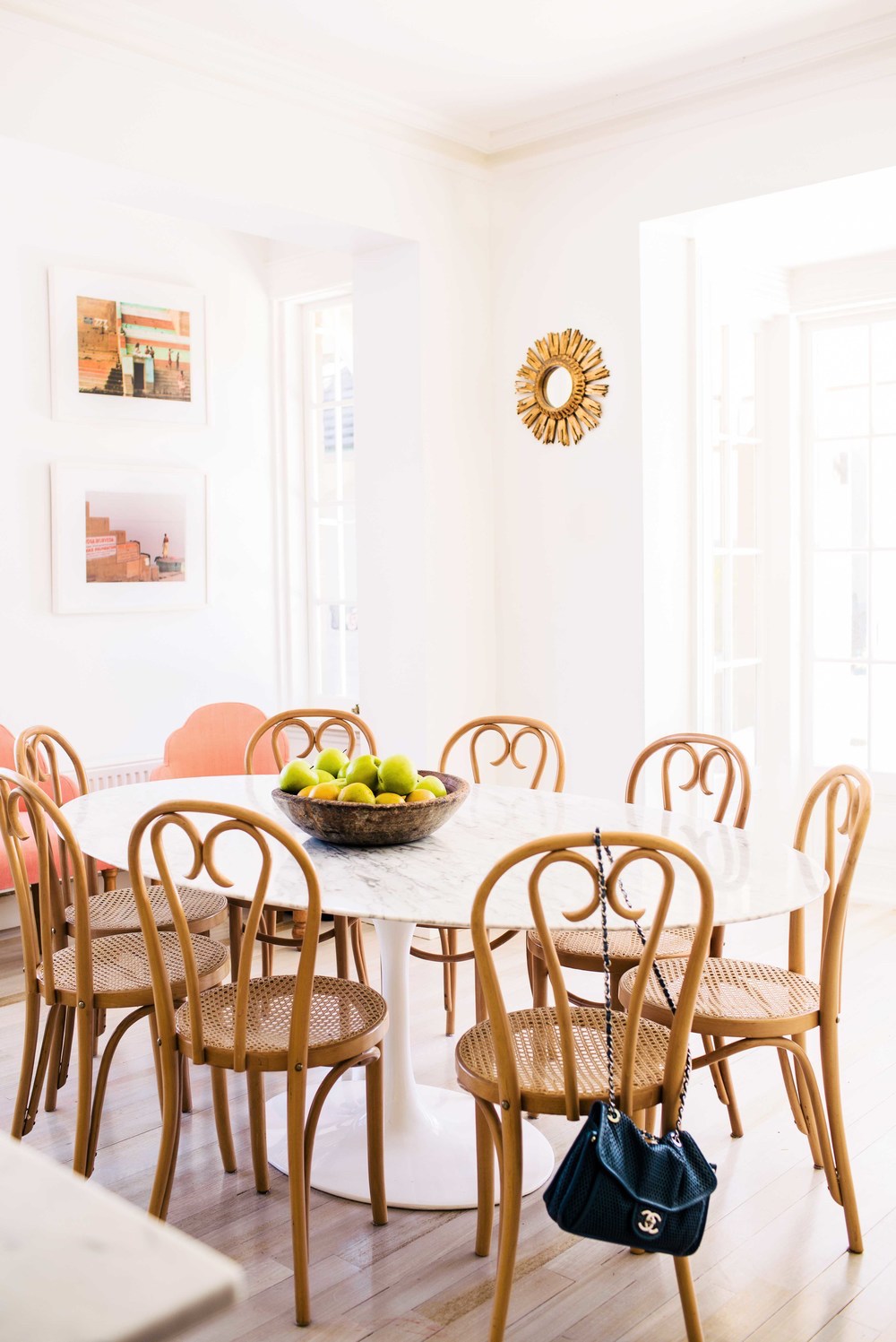 Dining room with bentwood chairs and marble table