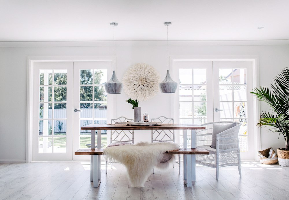 Dining room with glass doors via Three Birds Renovations