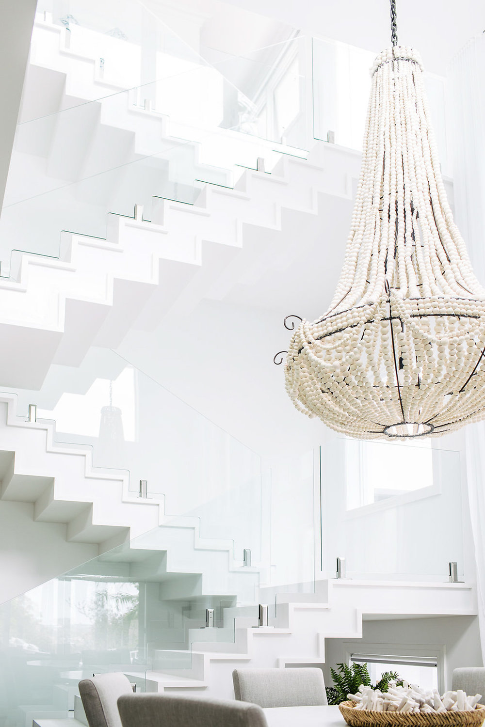 Dining room with white beaded chandelier