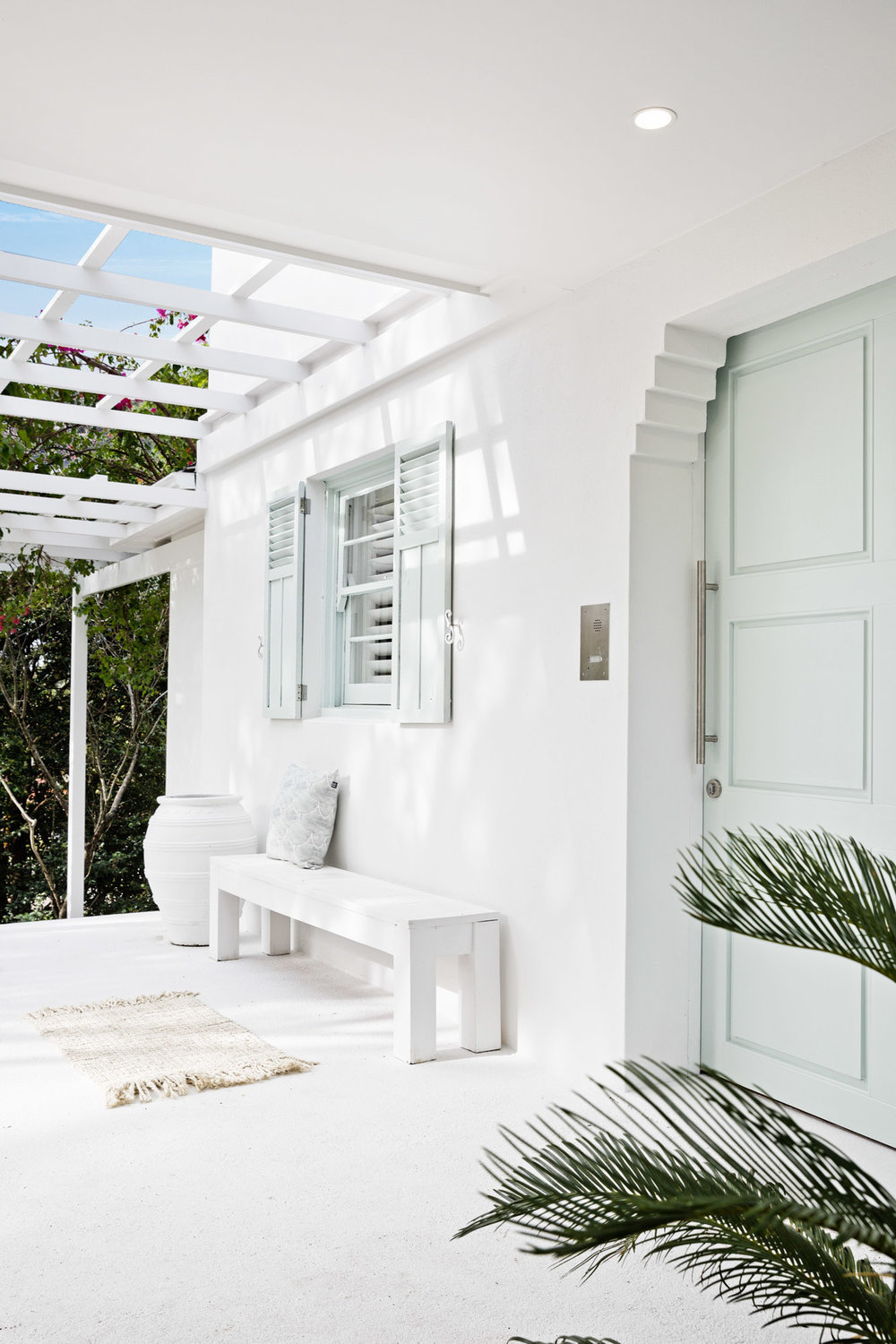 Front entrance with mint green door