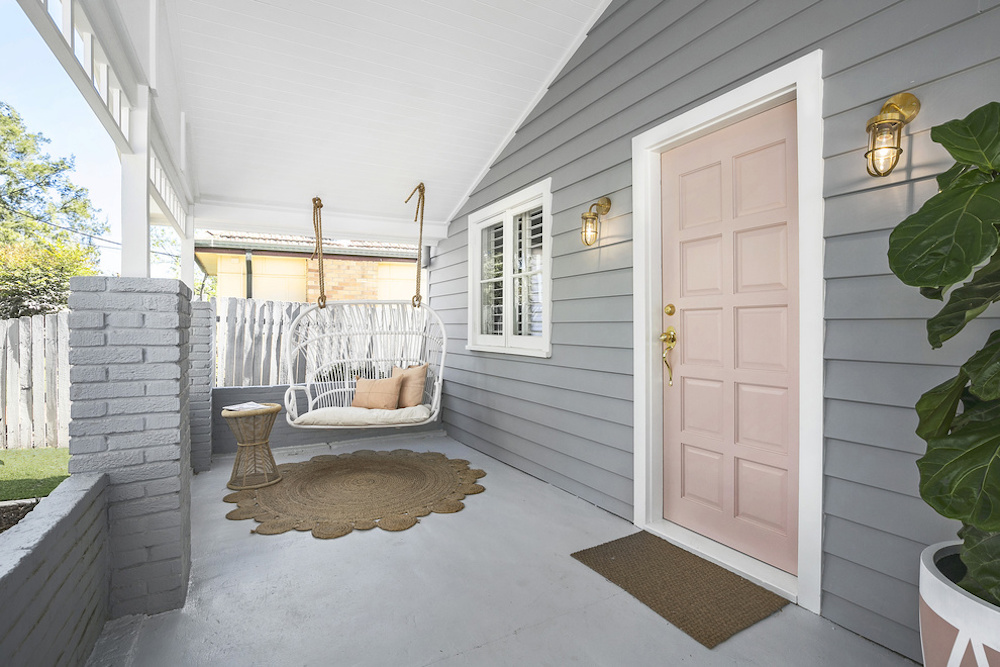 Front porch with pink front door