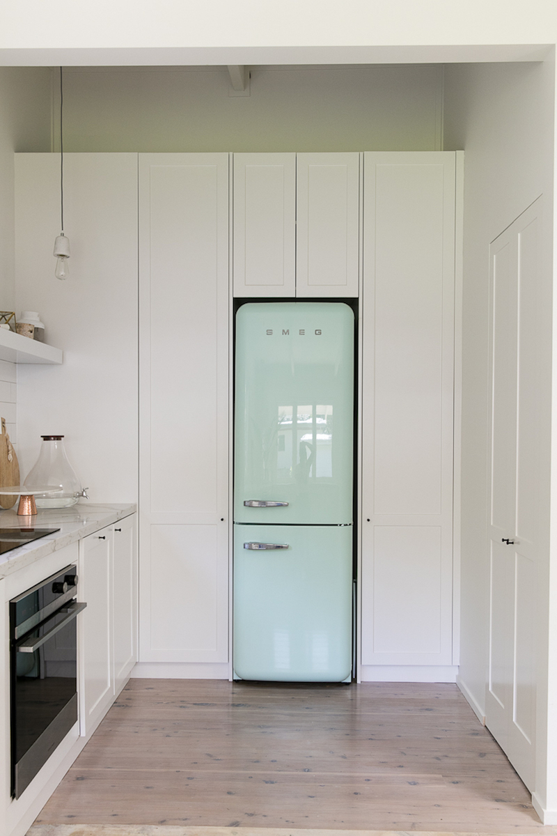 Kitchen with blue SMEG refrigerator