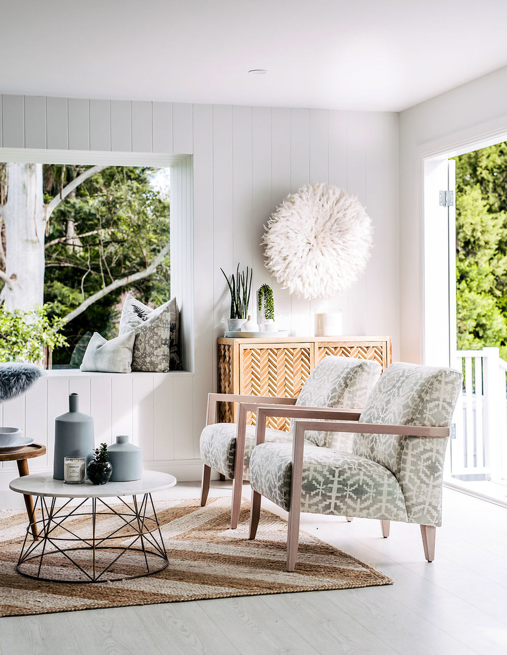 Living room in muted neutrals and nature by Three Birds Renovations