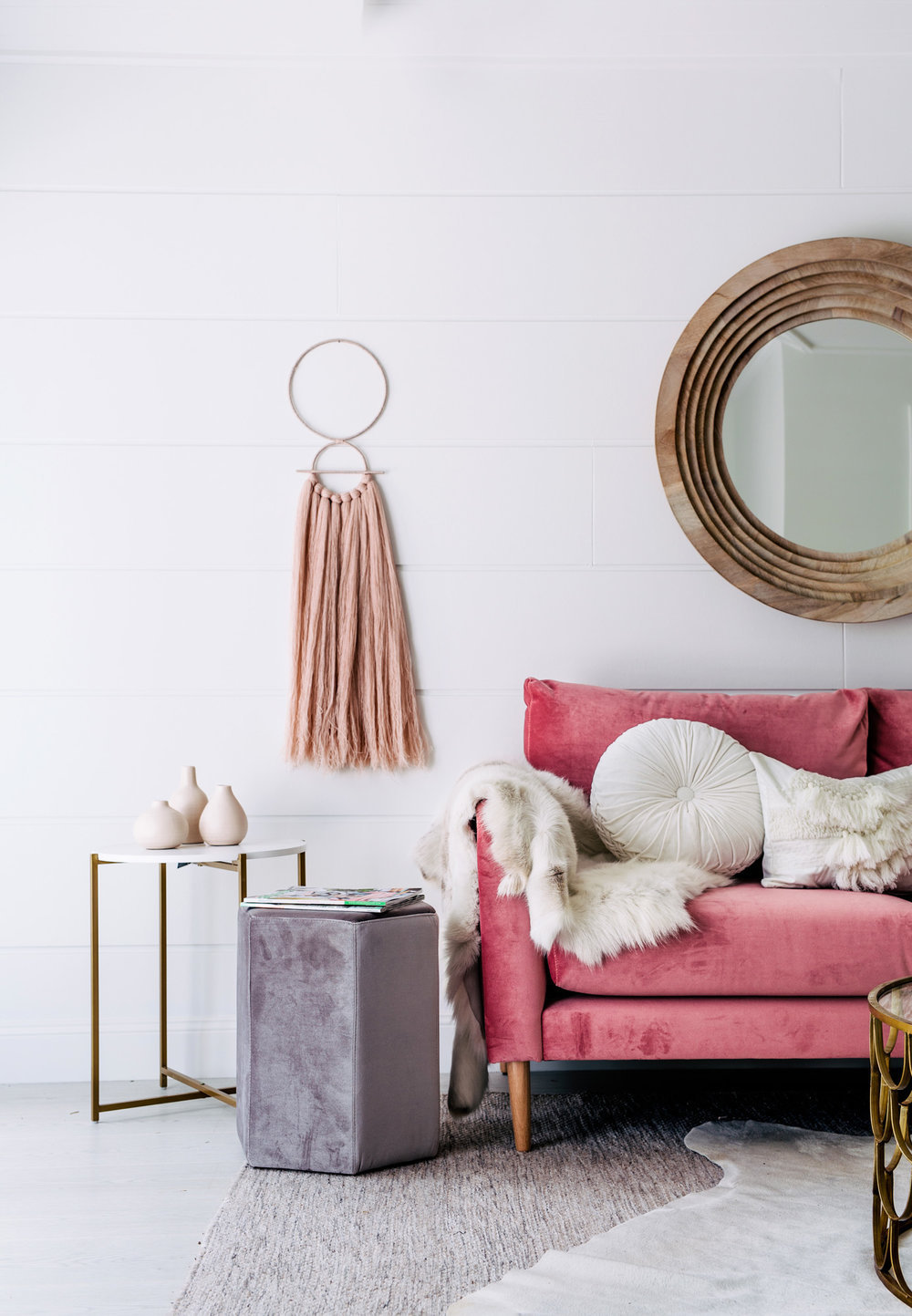 Living room with pink sofa and muted decor