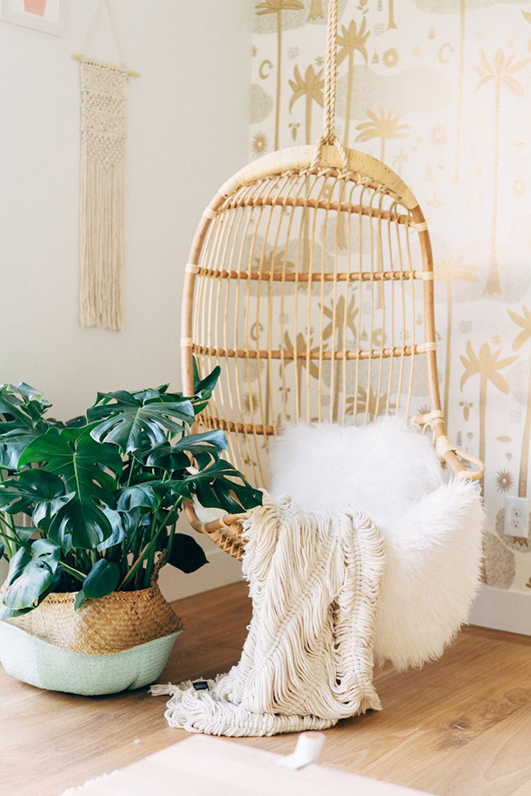 Rattan hanging chair with fur throw via GG