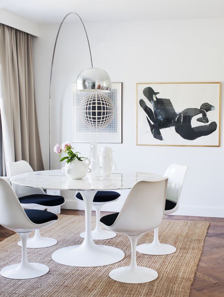 White marble tulip table with 60s chairs and arc floor lamp