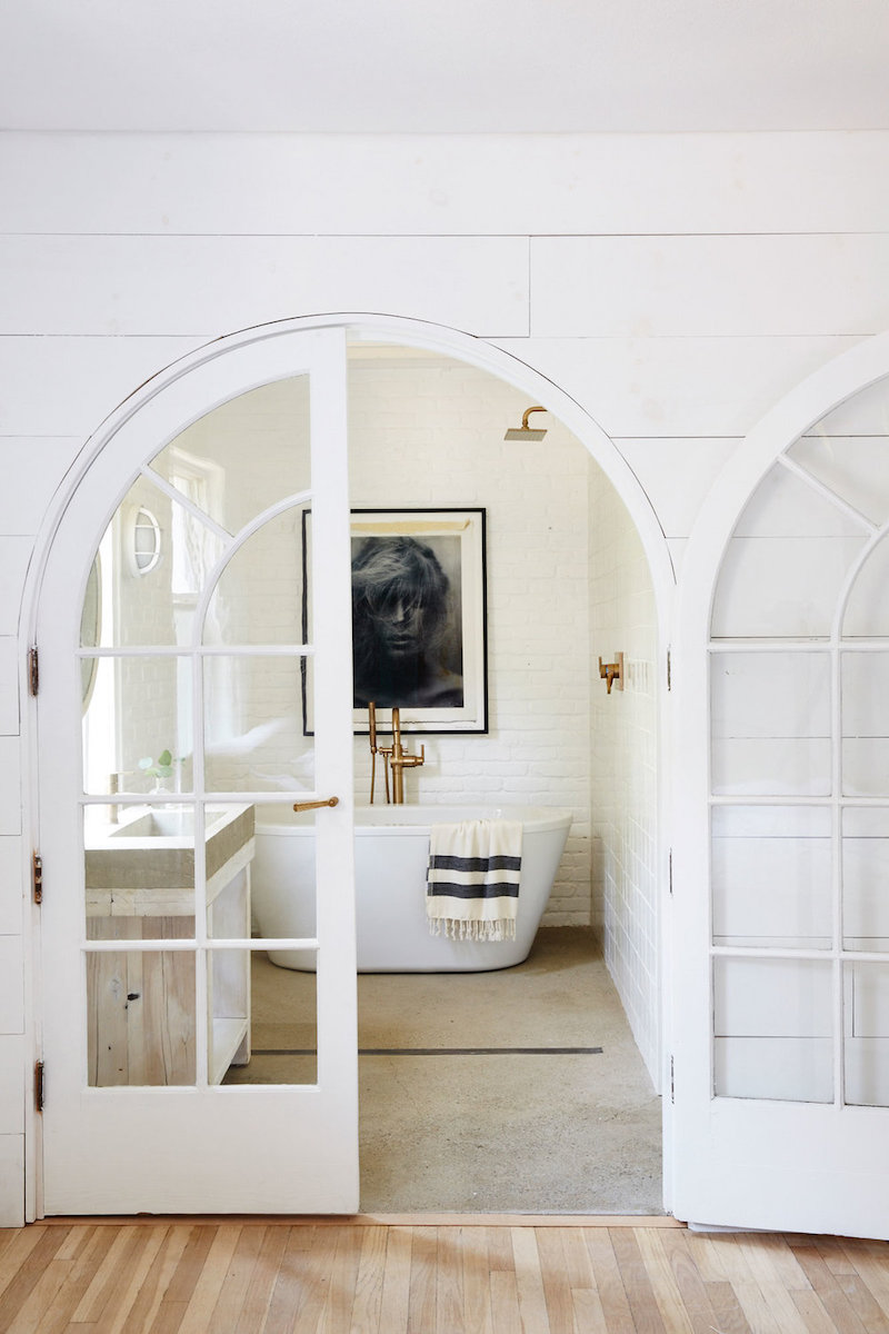 Master bath with freestanding white tub via nicole franzen