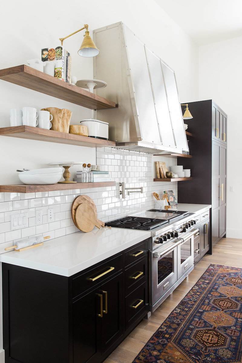 Black Kitchen Cabinets in Kitchen with Open Wood Shelving via Studio McGee