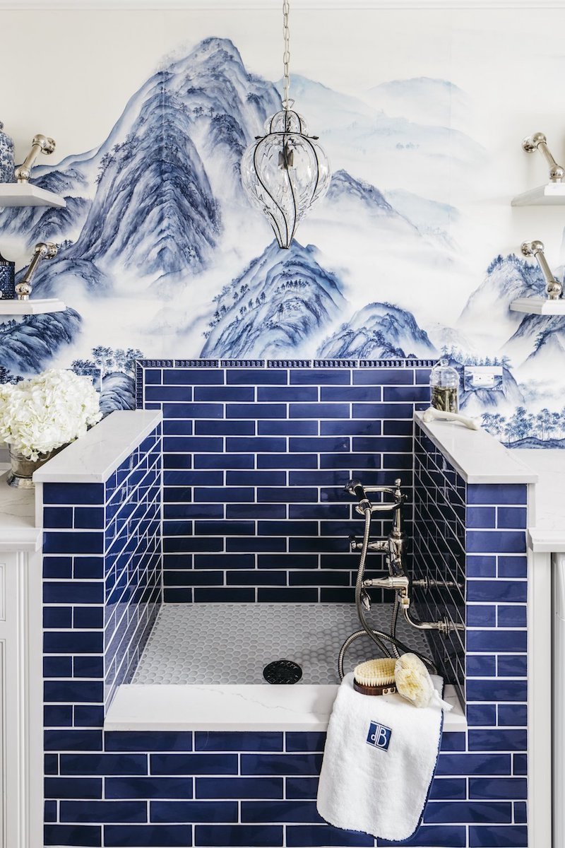 Cobalt blue tiled dog washing station with De Gournay chinoiserie wallpaper