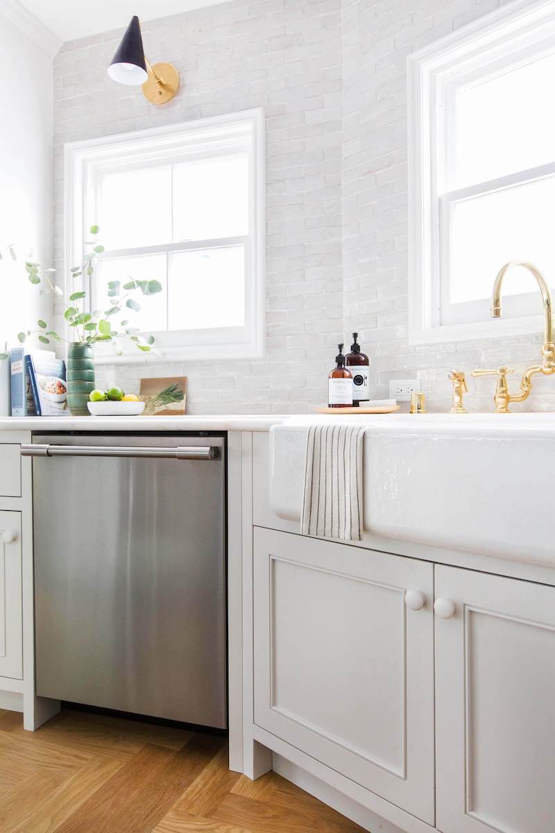 White farmhouse apron sink via Emily Henderson