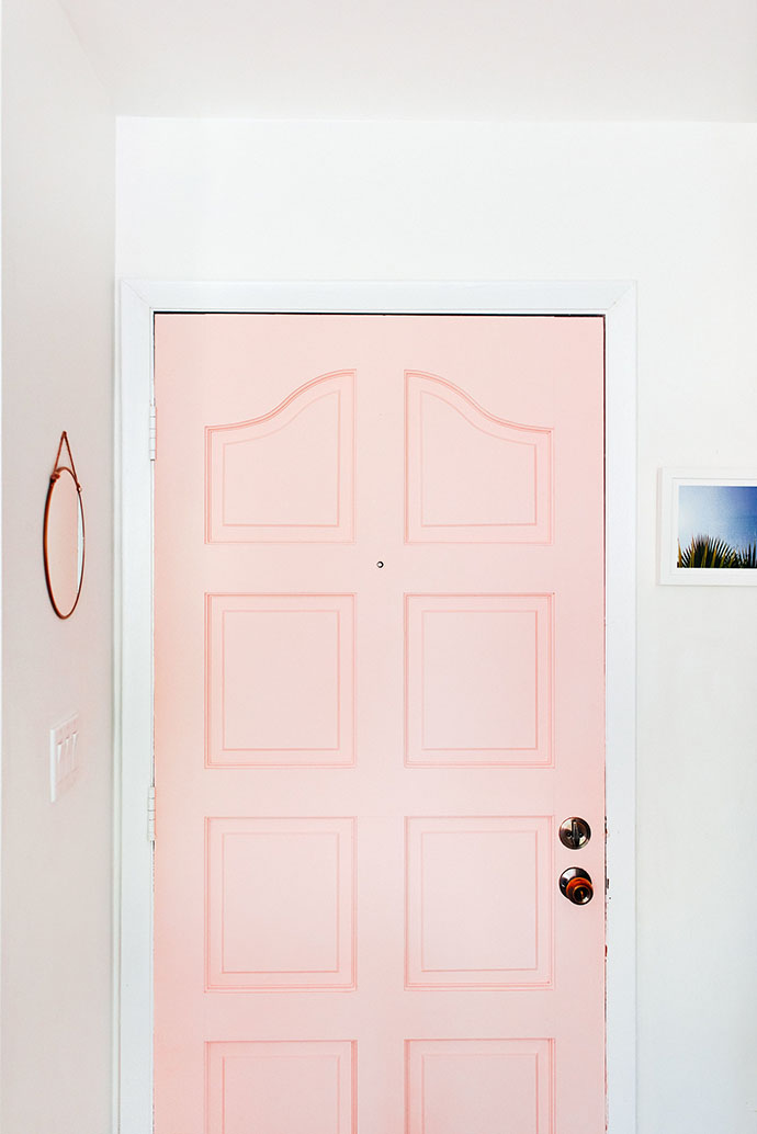 Soft pink front door via The Glitter Guide