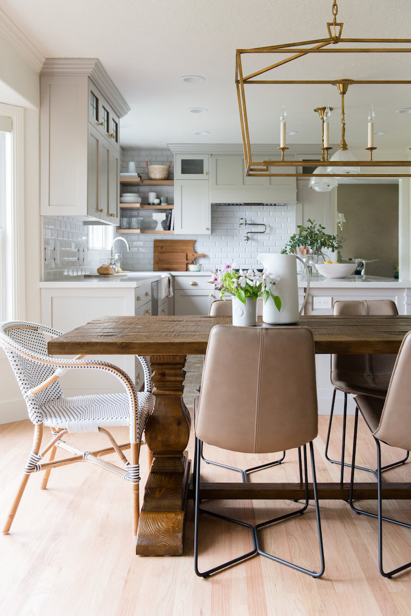 Gold cage light above dining room table via Studio McGee