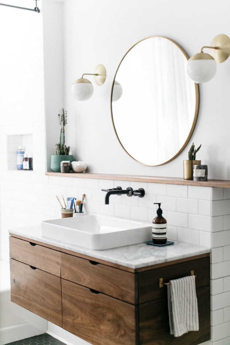 White Vessel Sinks on marble counter bathroom with gold mirror and brass sconces via SFGirlByBay