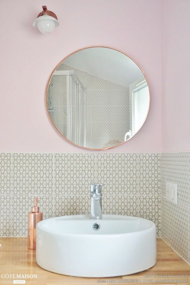 Copper bathroom mirror and copper soap dispenser in blush pink wall bathroom