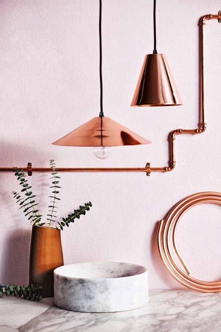 Copper pendants and accents against blush pink wall